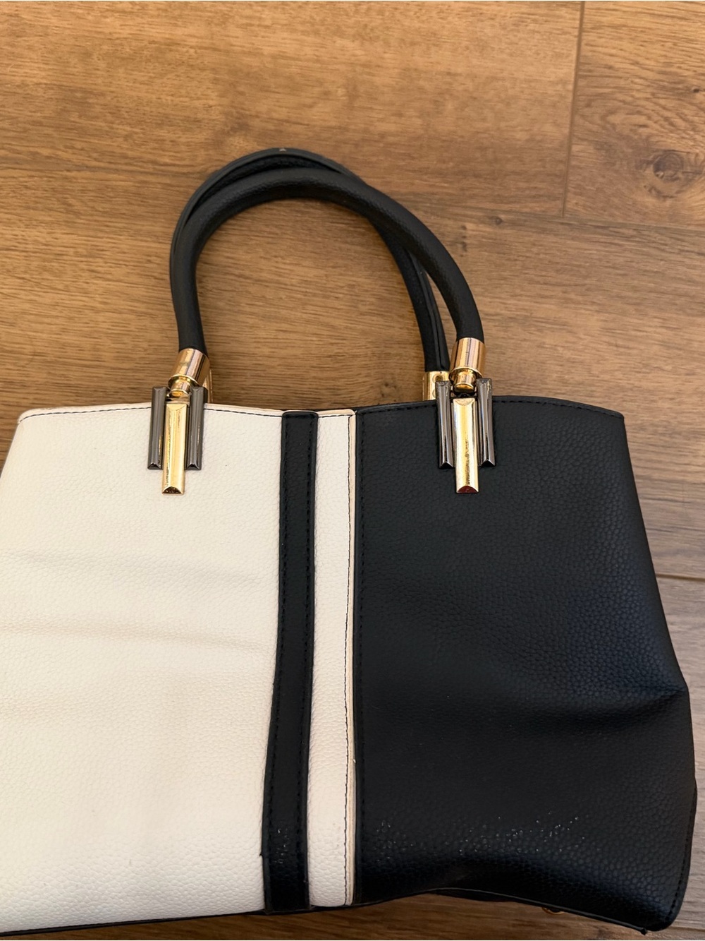 Structured Two-Tone Black and White purse with Gold Accents